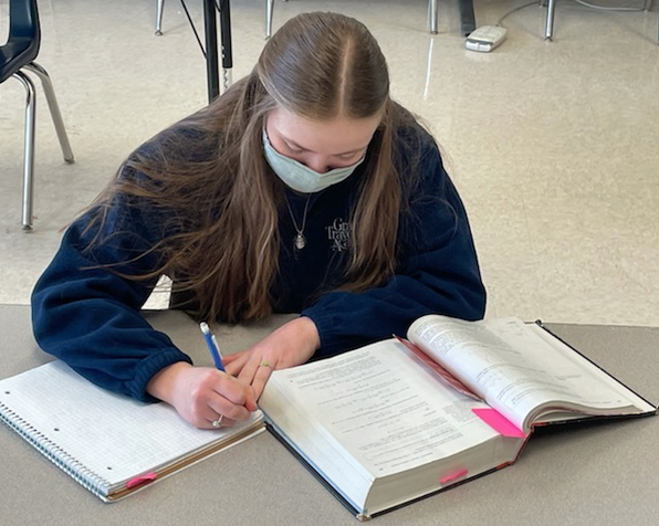 Student in a mask doing work