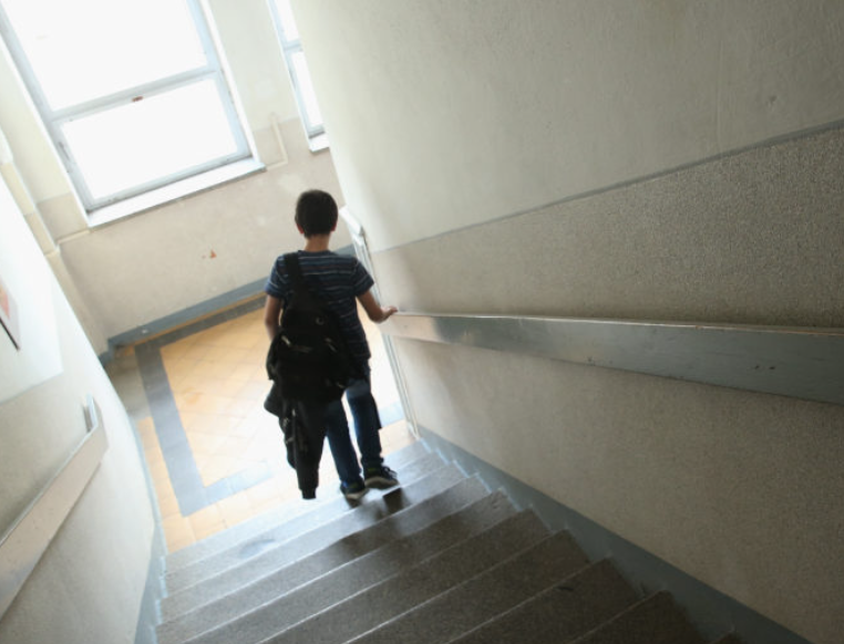 Student walking down stairs