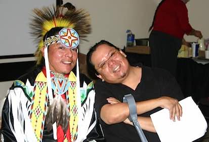 Photo: Brent Toadlena (in Native American dress) and Kester Tapaha at SDSU Pow Wow 