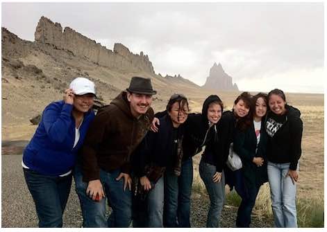 Photo: Chelsay Jimmie, Felipe Zañartu, Roberta Cruz, Mallory Rachel, Kieu Tang, Boa Xiong, Alyssa Ashley pose with Ship Rock in background