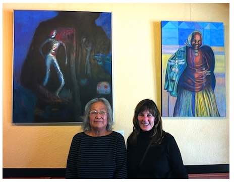 Photo: Photo: Carol Robinson-Zanartu poses with artist in front of 2 paintings on wall
