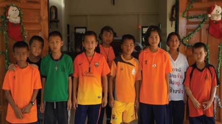 Photo: Group of children in bright Tshirts