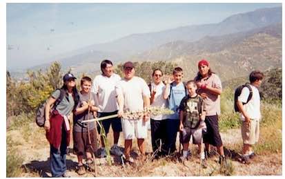 Photo: Boys hiking group. All Tribes students with Mimo Masuda (Japanese), Eugene Honanie (Hopi), Richard Aisaican (Cree) and Adrian Dorris.