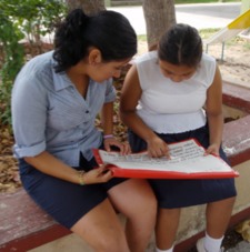 Photo: student and teacher reading together