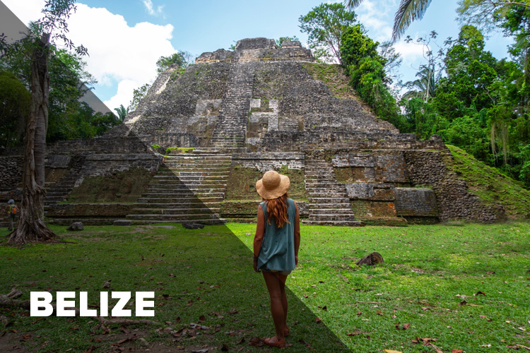 Female student in front of ancient pyramid in Belize