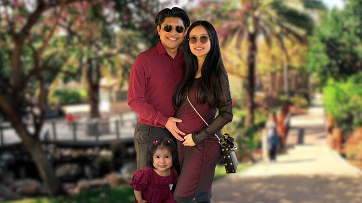 Javier Diego Jacinto poses with his wife and young daughter