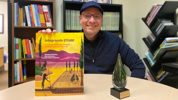 Alberto Esquinca with his book and AAHHE award